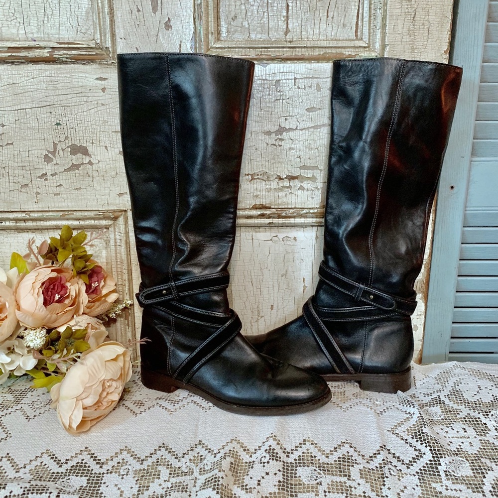 Tall black leather riding boots